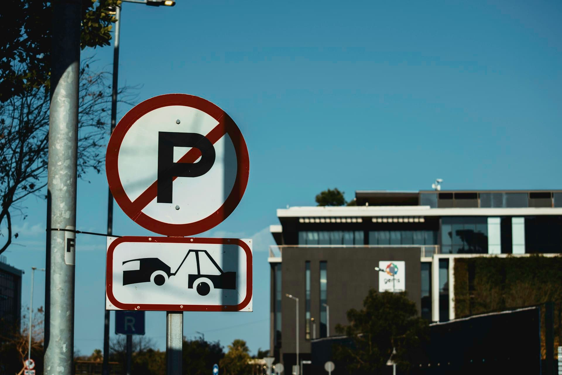 Parking regulation and tow away warning sign