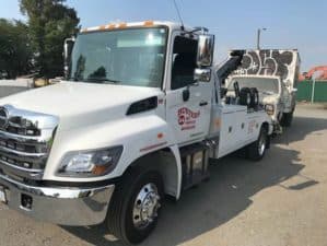 Busters heavy duty wrecker operating in secured commercial facility